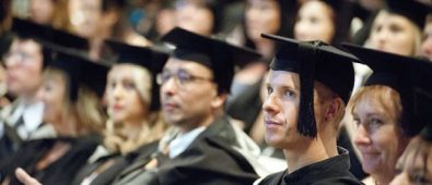 Group Of Abroad Students In Their Graduation Ceremony.